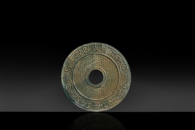 Lot 213 - A VERY RARE AQUAMARINE-BLUE GLASS ‘TAOTIE AND DRAGON’ DISC (BI), WESTERN HAN DYNASTY