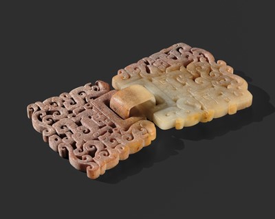 A VERY FINE PAIR OF PALE CELADON AND RUSSET JADE HINGED ‘DRAGONS AND PHOENIXES’ PLAQUES, WARRING STATES PERIOD