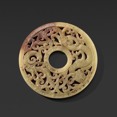 A SUPERB CELADON AND RUSSET JADE ‘DRAGON AND PHOENIX’ RETICULATED DISK (BI), WESTERN HAN DYNASTY