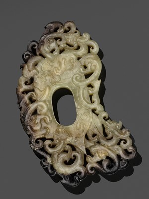 AN EXCELLENT PALE CELADON AND BROWN JADE RETICULATED ‘ARCHER’S RING’ PENDANT, HAN DYNASTY