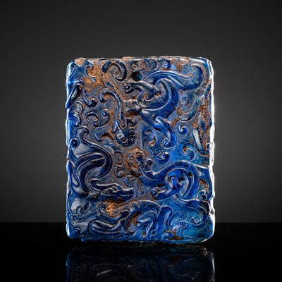 Lot 214 - AN ARCHAIC COBALT-BLUE GLASS ‘DRAGON’ PLAQUE, PROBABLY HAN DYNASTY