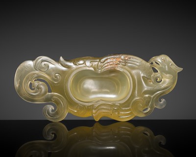 Lot 215 - A RARE OCHRE GLASS ‘PHOENIX’ BRUSH WASHER, POSSIBLY SIX-DYNASTIES PERIOD