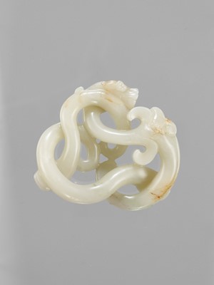Lot 786 - A LARGE CELADON JADE CARVING OF THREE INTERTWINED DRAGONS, LATE QING TO REPUBLIC