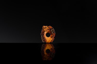 Lot 97 - A RUSSET JADE ‘CHILONG AND PHOENIX’ ARCHER’S RING PENDANT, SHE, HAN DYNASTY