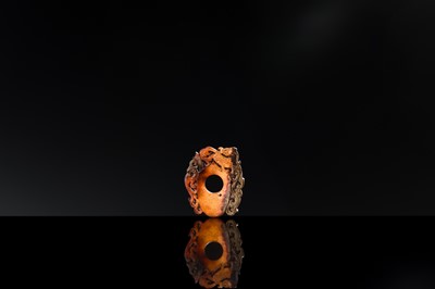 Lot 97 - A RUSSET JADE ‘CHILONG AND PHOENIX’ ARCHER’S RING PENDANT, SHE, HAN DYNASTY