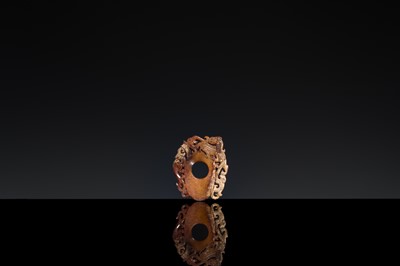 Lot 97 - A RUSSET JADE ‘CHILONG AND PHOENIX’ ARCHER’S RING PENDANT, SHE, HAN DYNASTY