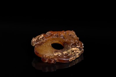 Lot 97 - A RUSSET JADE ‘CHILONG AND PHOENIX’ ARCHER’S RING PENDANT, SHE, HAN DYNASTY