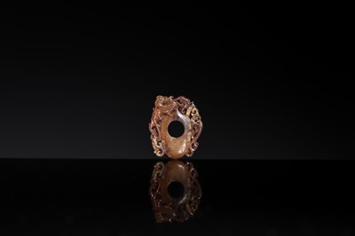 Lot 97 - A RUSSET JADE ‘CHILONG AND PHOENIX’ ARCHER’S RING PENDANT, SHE, HAN DYNASTY
