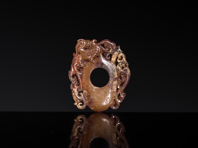 Lot 97 - A RUSSET JADE ‘CHILONG AND PHOENIX’ ARCHER’S RING PENDANT, SHE, HAN DYNASTY