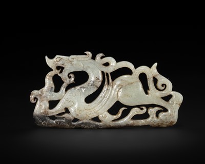 A FINE PALE CELADON JADE RETICULATED ‘WINGED DRAGON’ PENDANT, WARRING STATES PERIOD TO WESTERN HAN DYNASTY