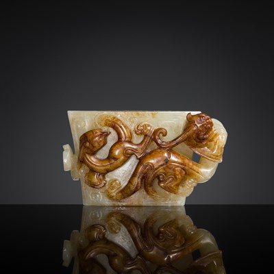 Lot 264 - A MAGNIFICENT WHITE AND RUSSET JADE ‘DRAGON’ SCABBARD CHAPE, WESTERN HAN DYNASTY