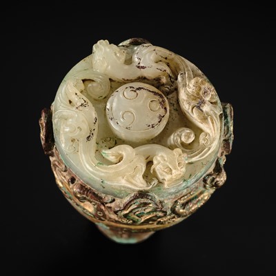 Lot 61 - A VERY RARE JADE-INLAID GILT-BRONZE ‘DRAGON’ FINIAL, WESTERN HAN DYNASTY