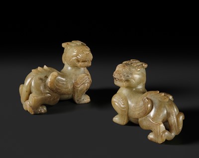 Lot 259 - A PAIR OF PALE CELADON AND BROWN JADE ‘BIXIE’ FIGURES, HAN DYNASTY