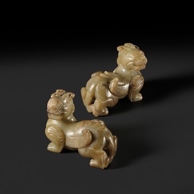 Lot 259 - A PAIR OF PALE CELADON AND BROWN JADE ‘BIXIE’ FIGURES, HAN DYNASTY