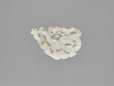 Lot 782 - A WHITE JADE ‘DRAGON’ PENDANT, LATE QING TO REPUBLIC