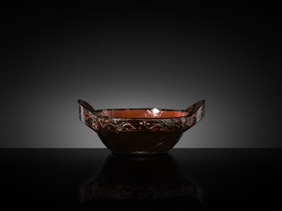 Lot 104 - A BROWN AND RED LACQUER ‘EAR’ CUP, ERBEI, WARRING STATES PERIOD TO WESTERN HAN DYNASTY
