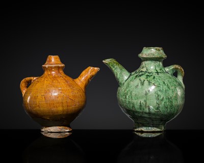 Lot 154 - TWO MINIATURE AMBER- AND GREEN-GLAZED EARTHENWARE EWERS, LIAO DYNASTY