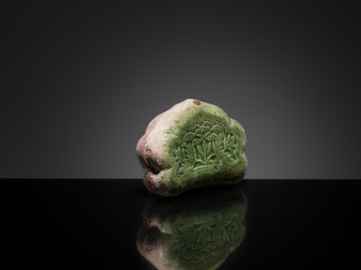 Lot 143 - A CIZHOU RUYI-SHAPED MINIATURE PILLOW, 10TH-11TH CENTURY