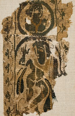 Lot 21 - A FRAGMENT OF A COPTIC TEXTILE WITH A MAENAD, EARLY BYZANTINE PERIOD, CIRCA 4TH-6TH CENTURY