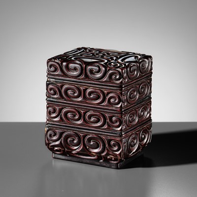 Lot 130 - A RARE THREE-TIERED BLACK AND CINNABAR TIXI LACQUER BOX, MING DYNASTY