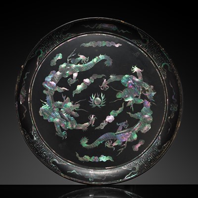Lot 279 - A MOTHER-OF-PEARL INLAID LACQUER ‘DRAGONS CHASING A PEARL’ DISH, RYUKYU ISLANDS, EDO PERIOD, 18TH CENTURY