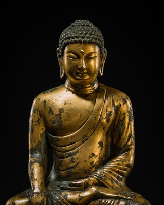 Lot 116 - A GILT-BRONZE FIGURE OF BUDDHA SHAKYAMUNI, UNIFIED SILLA PERIOD (668-935 AD), CIRCA LATE 9TH - EARLY 10TH CENTURY