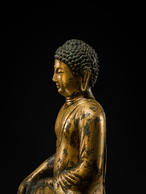 Lot 116 - A GILT-BRONZE FIGURE OF BUDDHA SHAKYAMUNI, UNIFIED SILLA PERIOD (668-935 AD), CIRCA LATE 9TH - EARLY 10TH CENTURY