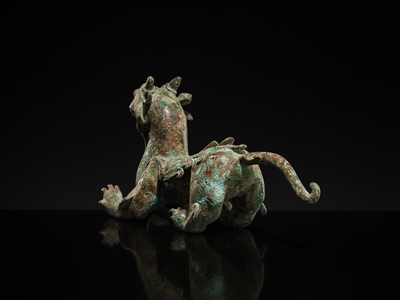Lot 44 - A RARE AND IMPORTANT BRONZE FIGURE OF A BIXIE, HAN DYNASTY
