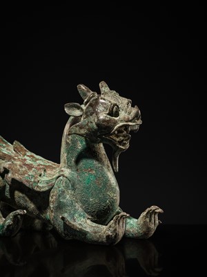 Lot 44 - A RARE AND IMPORTANT BRONZE FIGURE OF A BIXIE, HAN DYNASTY