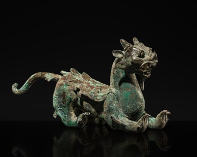 Lot 44 - A RARE AND IMPORTANT BRONZE FIGURE OF A BIXIE, HAN DYNASTY