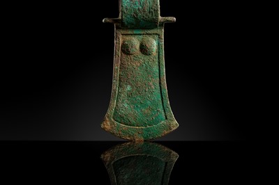 Lot 190 - A RARE BRONZE ‘COURTIER’ AXE-HEAD, WESTERN ZHOU DYNASTY