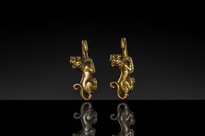 Lot 43 - A RARE PAIR OF GILT-BRONZE ‘TIGER’ GARMENT HOOKS, WESTERN HAN DYNASTY