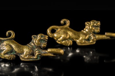 Lot 43 - A RARE PAIR OF GILT-BRONZE ‘TIGER’ GARMENT HOOKS, WESTERN HAN DYNASTY