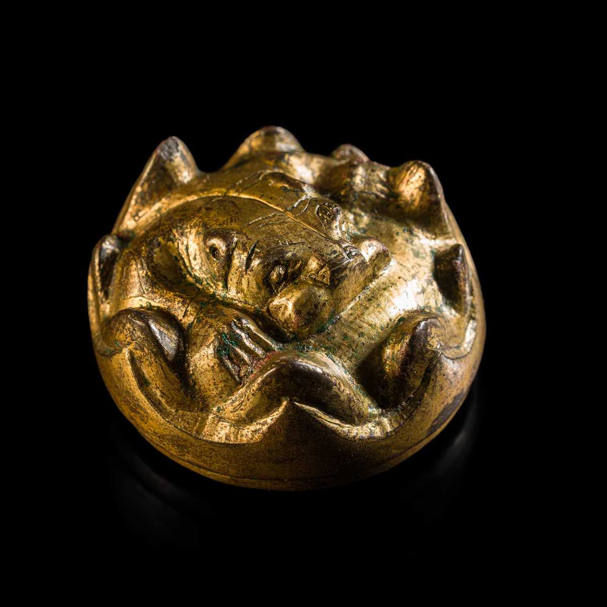 Lot 197 - A GILT-BRONZE TIGER-FORM ORNAMENT, HAN DYNASTY