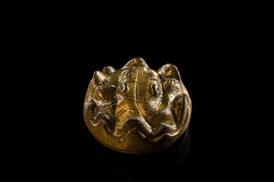 Lot 197 - A GILT-BRONZE TIGER-FORM ORNAMENT, HAN DYNASTY