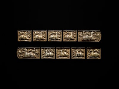 Lot 49 - A SET OF TEN GILT AND SILVERED COPPER REPOUSSÉ BELT PLAQUES, TANG TO LIAO DYNASTY
