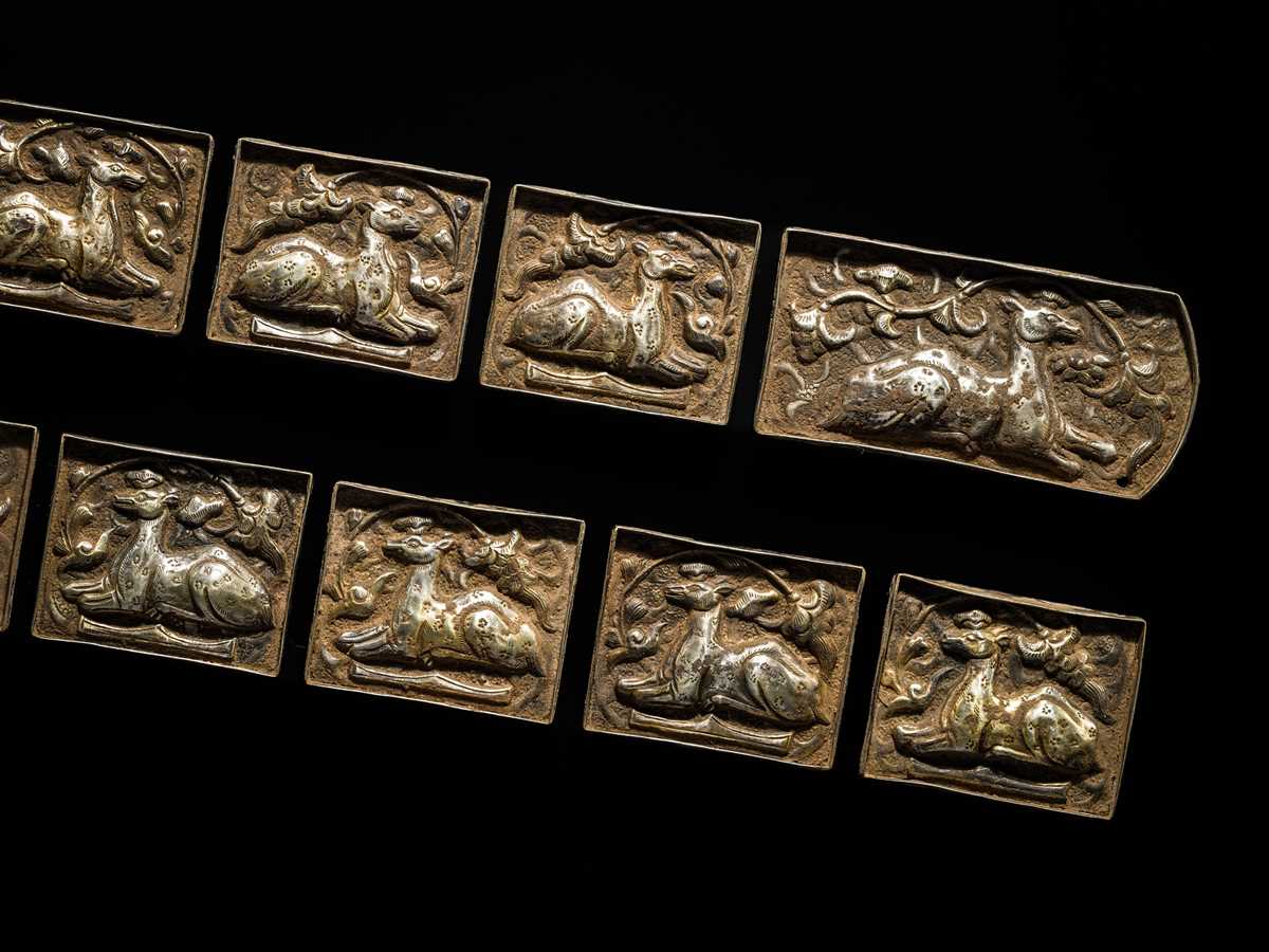 Lot 49 - A SET OF TEN GILT AND SILVERED COPPER REPOUSSÉ BELT PLAQUES, TANG TO LIAO DYNASTY
