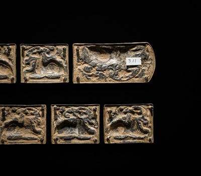 Lot 49 - A SET OF TEN GILT AND SILVERED COPPER REPOUSSÉ BELT PLAQUES, TANG TO LIAO DYNASTY
