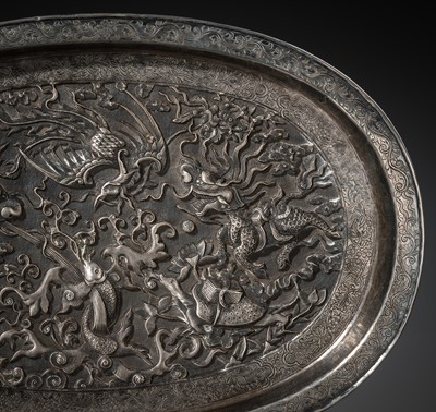 Lot 103 - A SILVER-REPOUSSÉ ‘FOUR SYMBOLS’ TRAY, SI XIANG, CHINA, 18TH-19TH CENTURY OR EARLIER