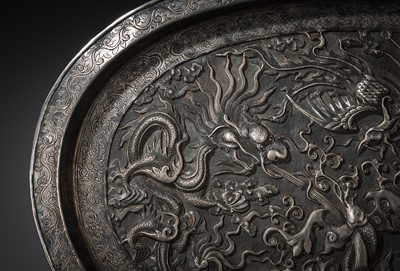 Lot 103 - A SILVER-REPOUSSÉ ‘FOUR SYMBOLS’ TRAY, SI XIANG, CHINA, 18TH-19TH CENTURY OR EARLIER
