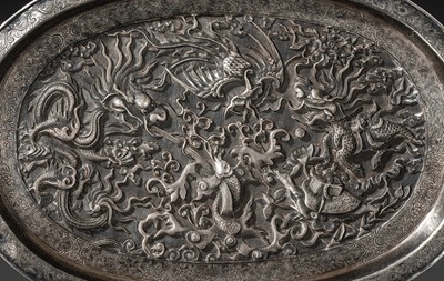 Lot 103 - A SILVER-REPOUSSÉ ‘FOUR SYMBOLS’ TRAY, SI XIANG, CHINA, 18TH-19TH CENTURY OR EARLIER