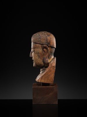 Lot 105 - A CARVED WOOD HEAD OF A BUDDHIST DISCIPLE, LATE MING TO EARLY QING DYNASTY