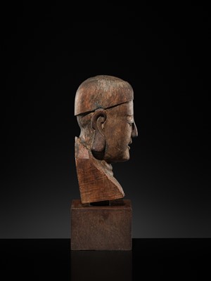 Lot 105 - A CARVED WOOD HEAD OF A BUDDHIST DISCIPLE, LATE MING TO EARLY QING DYNASTY