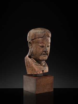 Lot 105 - A CARVED WOOD HEAD OF A BUDDHIST DISCIPLE, LATE MING TO EARLY QING DYNASTY