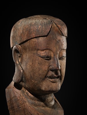 Lot 105 - A CARVED WOOD HEAD OF A BUDDHIST DISCIPLE, LATE MING TO EARLY QING DYNASTY
