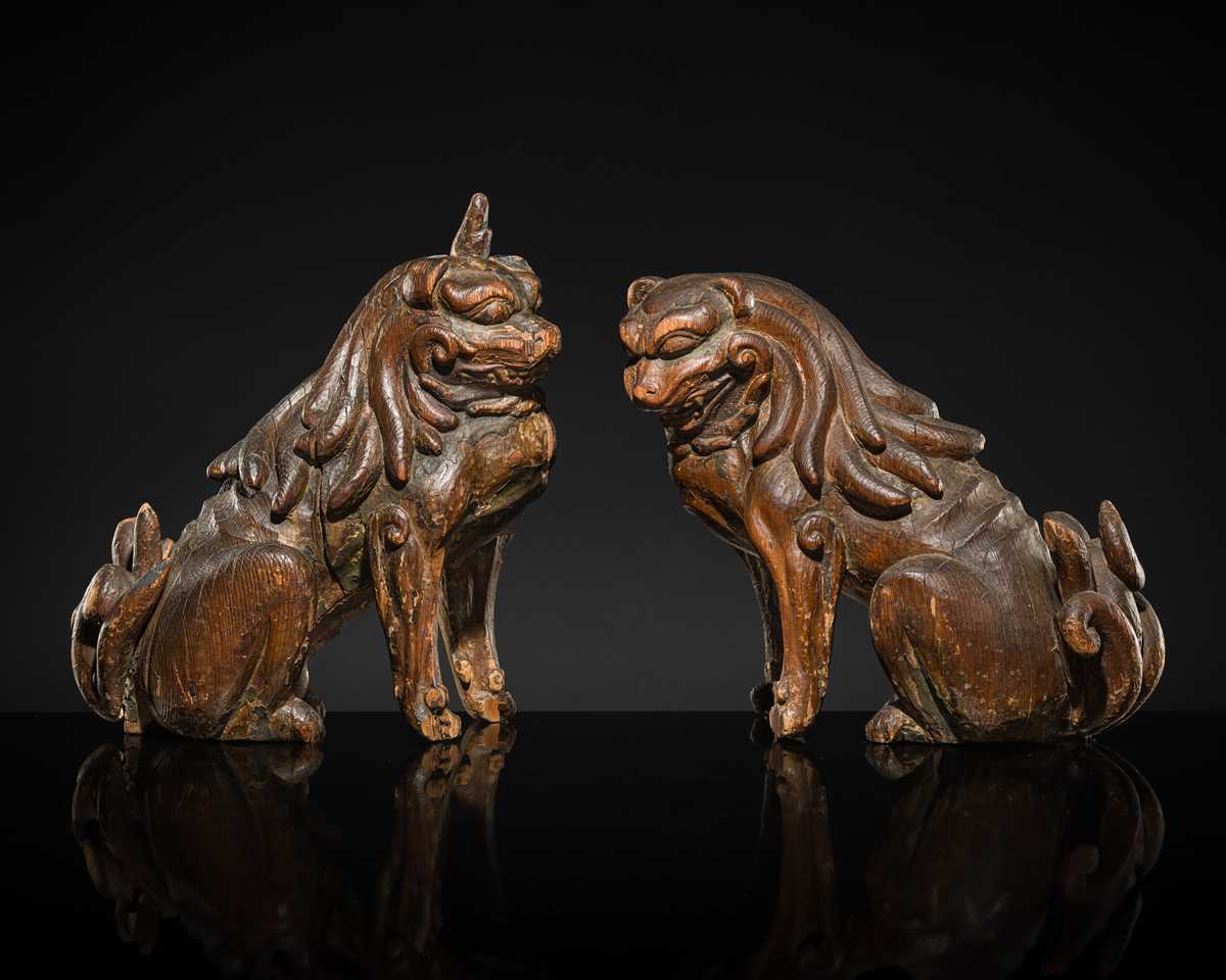 Lot 131 - A PAIR OF POLYCHROME WOOD FIGURES OF KOMA-INU, KAMAKURA PERIOD