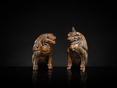 Lot 131 - A PAIR OF POLYCHROME WOOD FIGURES OF KOMA-INU, KAMAKURA PERIOD