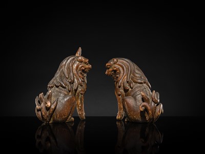 Lot 131 - A PAIR OF POLYCHROME WOOD FIGURES OF KOMA-INU, KAMAKURA PERIOD