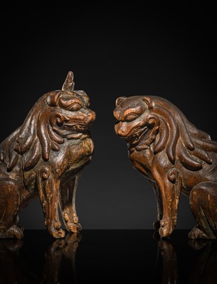 Lot 131 - A PAIR OF POLYCHROME WOOD FIGURES OF KOMA-INU, KAMAKURA PERIOD