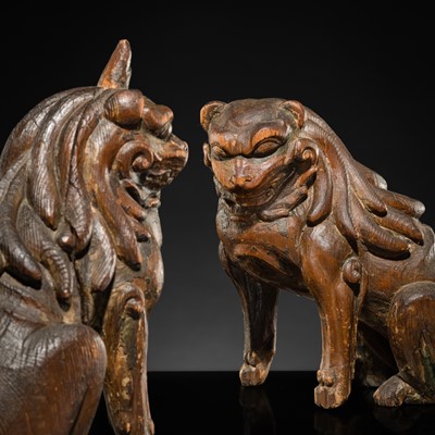 Lot 131 - A PAIR OF POLYCHROME WOOD FIGURES OF KOMA-INU, KAMAKURA PERIOD